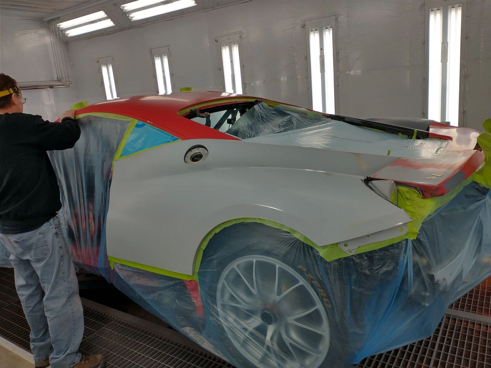 Car being masked and prepared for custom paint at Astro Collision
