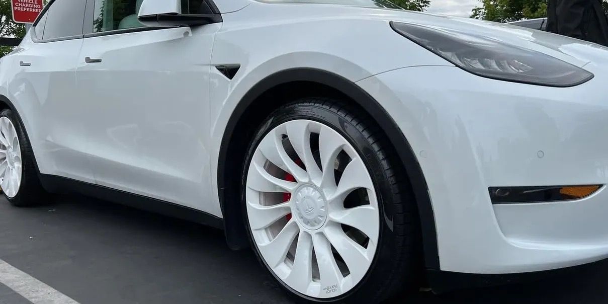 White Tesla Model Y with custom white painted rims — rim painting at Astro Collision